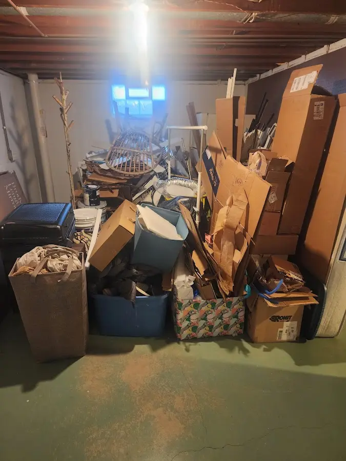 Roll-off dumpster container at job site for Concrete Dumpster Rental in Bolton